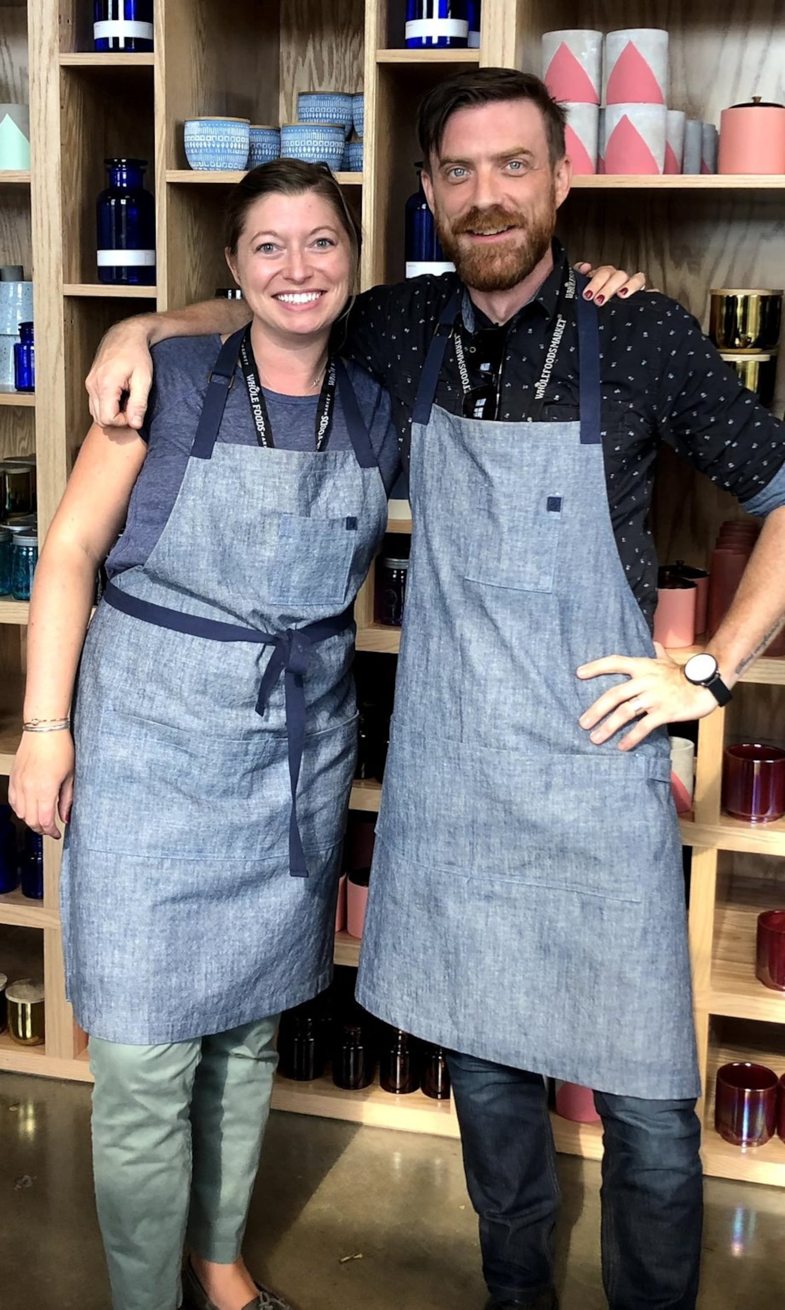 Kristin Sherman (left) and Jason Autry of Whole Foods Market are seen in front of the Paddywax Candle Bar at the chain’s Nashville store. CONTRIBUTED BY WHOLE FOODS MARKET