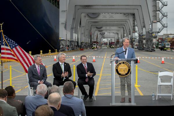 Georgia Gov. Brian Kemp, right, speaks during a visit to the Port of Savannah on Monday. From left to right: Republican U.S. Reps. Buddy Carter of St. Simons Island, Mike Collins of Jackson and Sam Graves of Missouri.