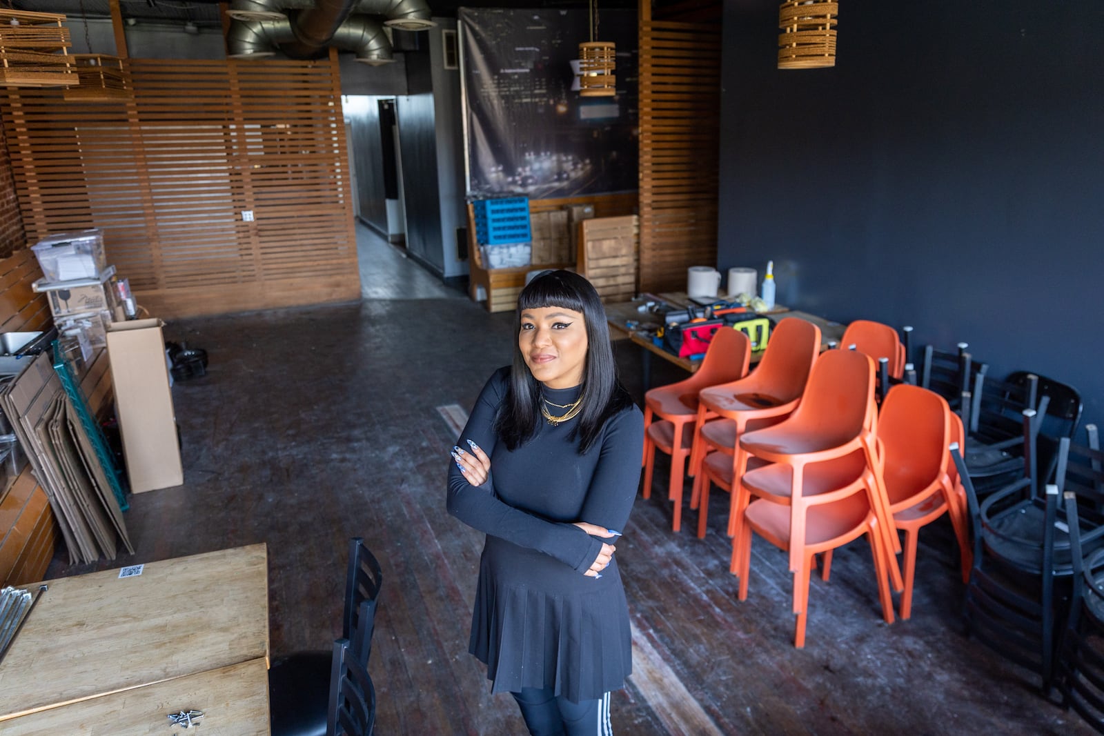 Ree De La Vega, who has taken over the lease of former restaurant and lounge The Sound Table, poses for a portrait in the space as it is renovated in Atlanta on Tuesday, April 16, 2024. (Arvin Temkar / arvin.temkar@ajc.com)