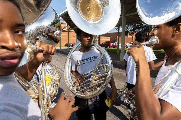 The Sound of Dutchtown high school marching band practices at Dutchtown High School in Hampton on Thursday, May 25, 2023. The band will play at a D-Day commemoration ceremony in France. (Arvin Temkar / arvin.temkar@ajc.com)