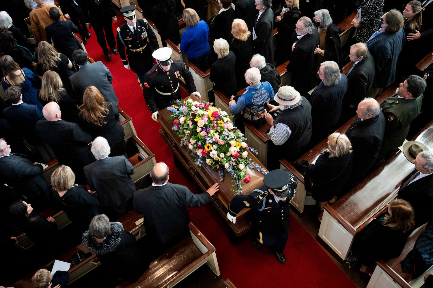 The coffin of former first lady Rosalynn Carter is escorted from her memorial service at Glenn Memorial Church in Atlanta, Nov. 28, 2023. (Erin Schaff/The New York Times)