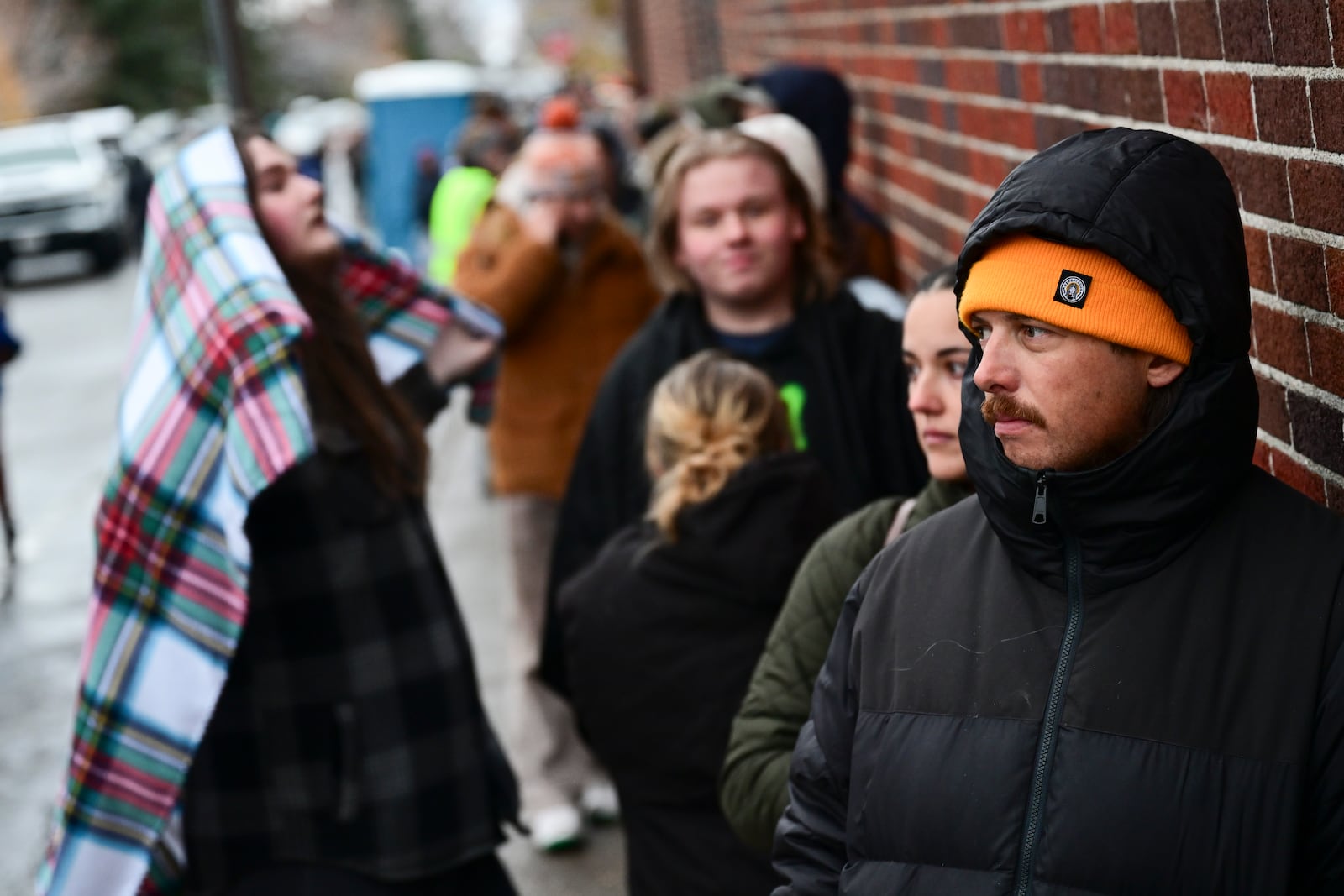 Chance Lenay waits in line to vote outside the Gallatin County Courthouse on Election Day in Bozeman, Mont., on Tuesday, Nov. 5, 2024. (AP Photo/Tommy Martino)