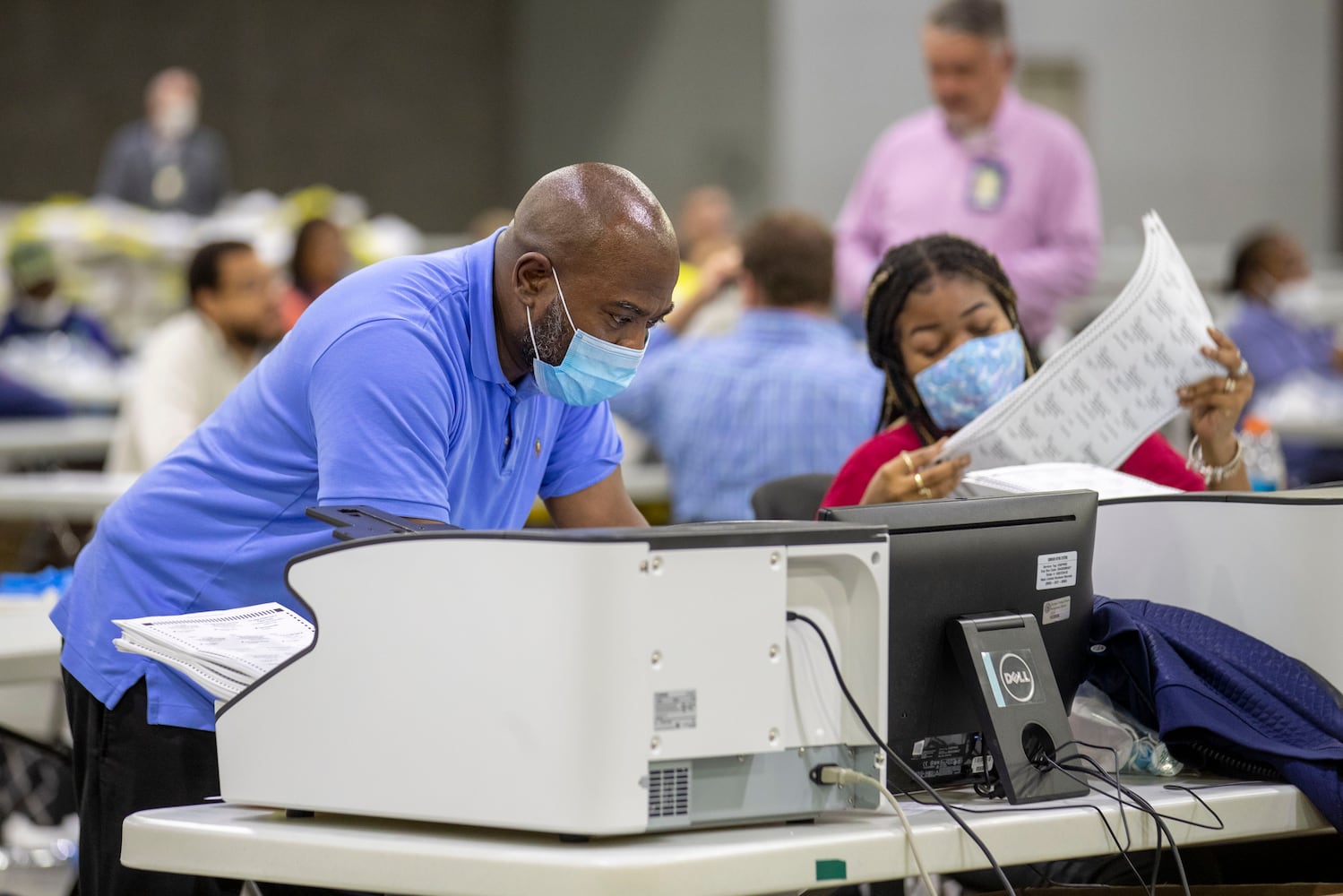 PHOTOS: Georgia voters struggle with long lines, new equipment, social distancing