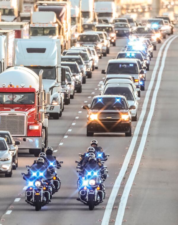 December 18, 2018 Gwinnett County The hearse carrying the body of DeKalb County Police Officer Edgar Isidro Flores was escorted from Whitfield Funeral Homes & Crematory in Demorest, Georgia down I-85 south at Steve Reynolds Blvd. in Gwinnett County (shown here) by police escort en route to the funeral service that was held Tuesday, Dec. 18, 2018 at All Saints Catholic Church on Mount Vernon Road in Dunwoody. A second service will be held at 11 a.m. Wednesday at Prince of Peace Catholic Church in Flowery Branch. Flores will be buried in Yonah Memorial Gardens in Demorest following the Wednesday funeral service, Channel 2 reported. Brandon Taylor, 33, is accused of shooting and killing Flores on Candler Road before running behind a business and shooting a K-9 in the head, AJC.com previously reported. Taylor was subsequently shot and killed by responding officers. JOHN SPINK/JSPINK@AJC.COM