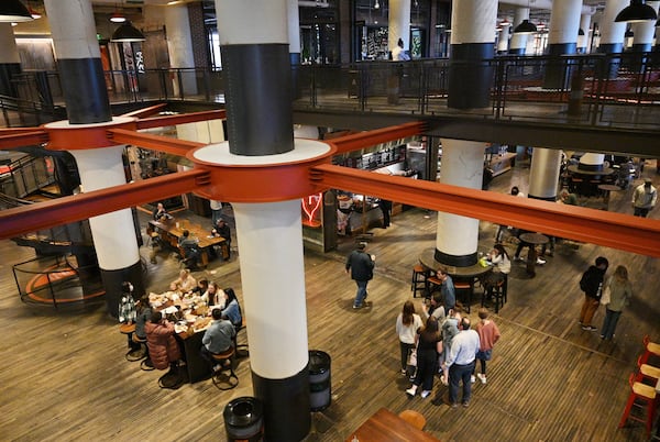 Customers shop and eat during lunch hour at Ponce City Market on a recent winter day. Jamestown Properties acquired the former Sears warehouse from the city of Atlanta a decade ago. (Hyosub Shin / Hyosub.Shin@ajc.com)