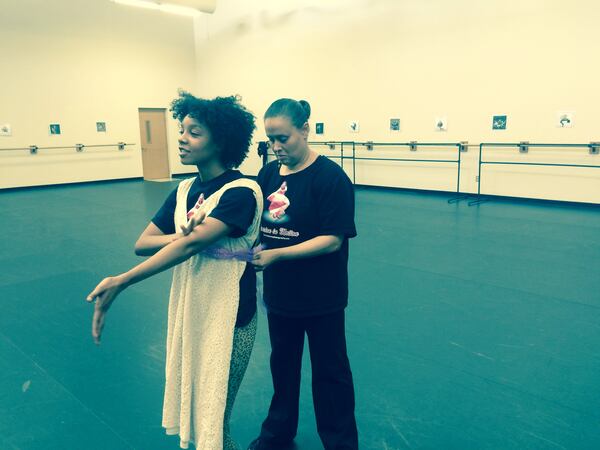 Director Rona Roberts helps dancer Mercedes McIntosh with a costume. Photo: Jennifer Brett