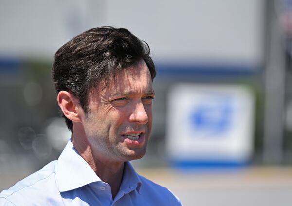 U.S. Sen. Jon Ossoff, D-Ga., speaks to members of the media during a press conference after personally inspecting the USPS Atlanta Regional Processing Facility (behind), Thursday, May 30, 2024, in Palmetto. Earlier this month, Sen. Ossoff launched a new inquiry requesting an update from USPS Postmaster General Louis DeJoy on the current on-time delivery statistics in the metro Atlanta area and across Georgia. (Hyosub Shin / AJC)