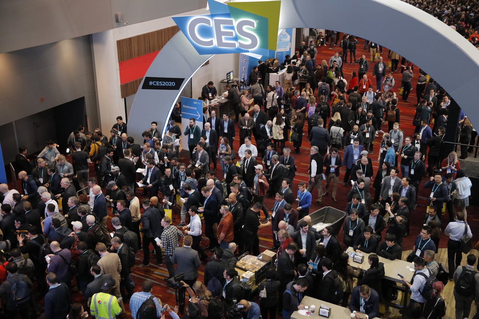 Crowds enter the convention center on the first day of the CES tech show, Tuesday, Jan. 7, 2020, in Las Vegas.