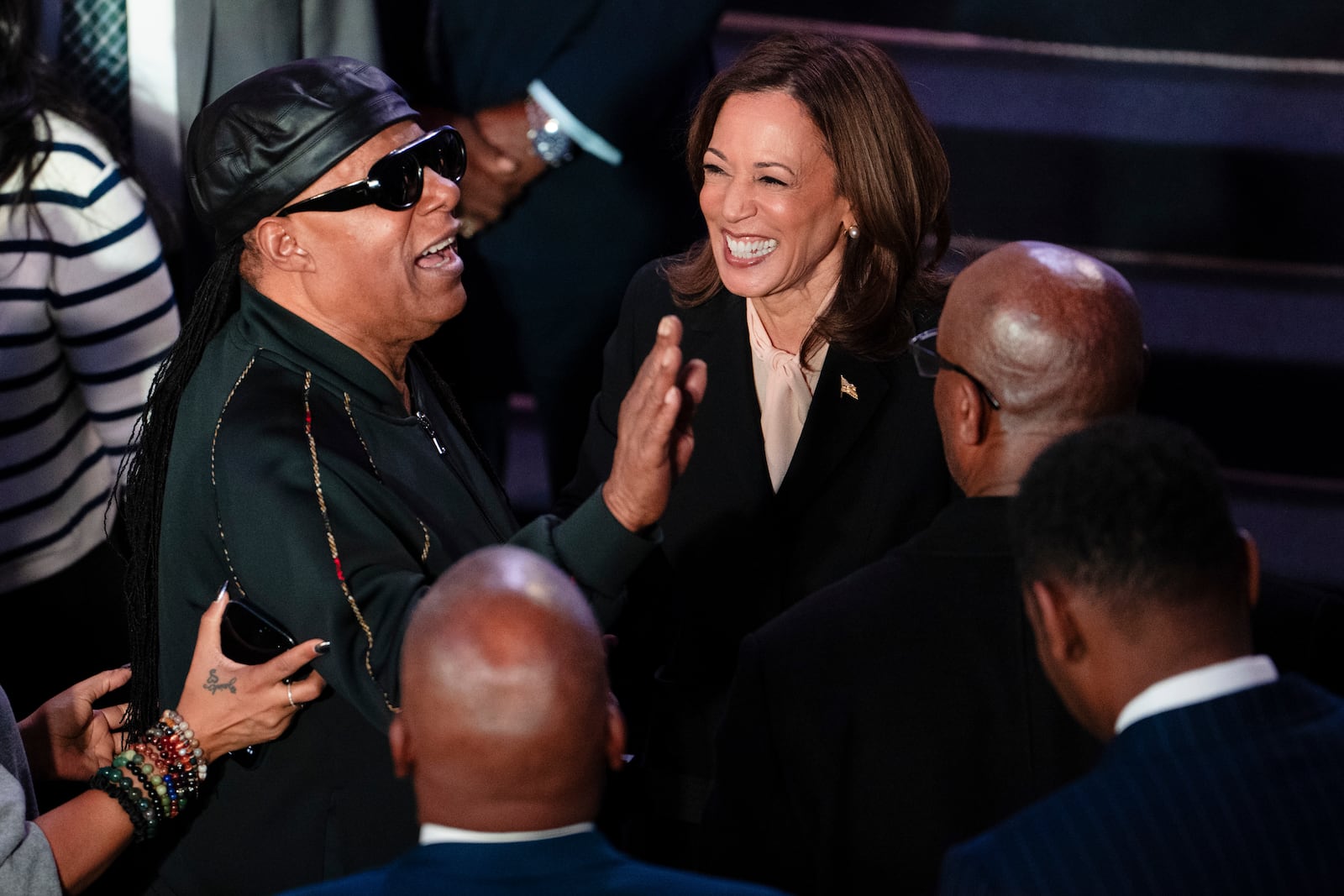 
                        Musician Stevie Wonder, left, and Vice President Kamala Harris, the Democratic presidential nominee, during an event at Divine Faith Ministries International in Jonesboro, Ga., on Sunday, Oct. 20, 2024. (Erin Schaff/The New York Times)
                      