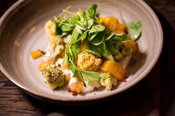 Sear Roasted Heirloom Cauliflower Salad with persimmons and marquis honey vinaigrette. Photo credit- Mia Yakel.