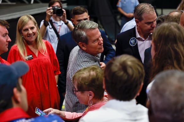 Gov. Brian Kemp greets supporters following his campaign rally at Cobb County International Airport on Nov. 7, 2022. (Natrice Miller/AJC)  