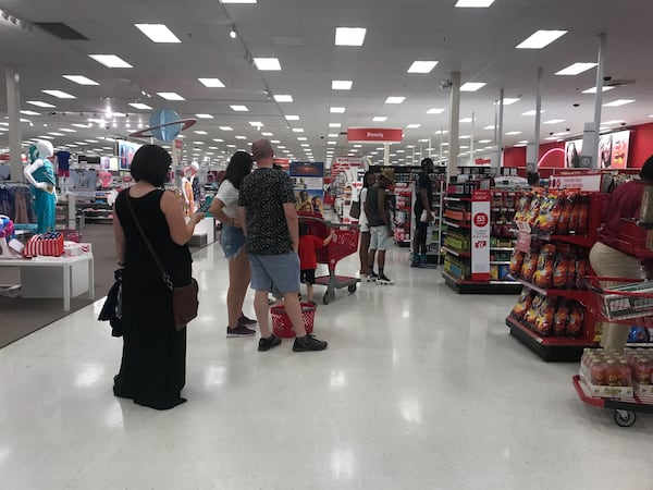 Customers experience delays at checkout at the Edgewood Target on Saturday, June 15, 2019.