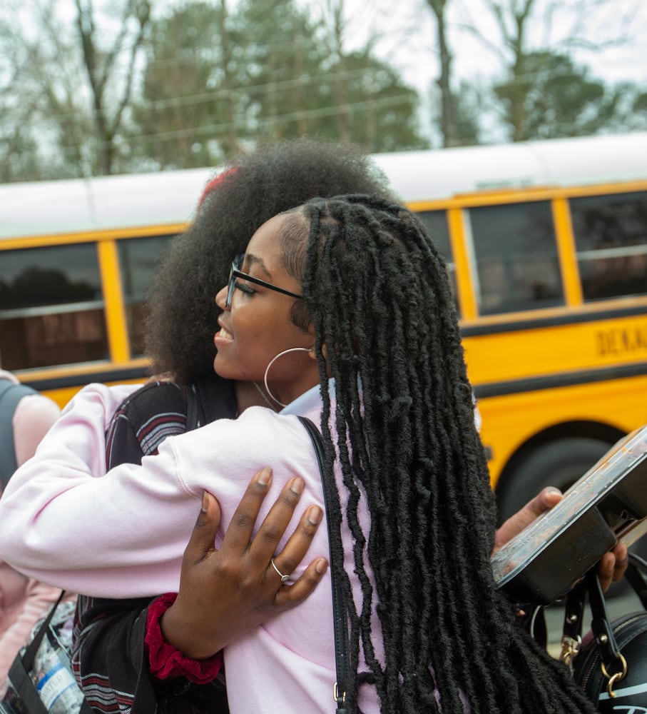 DeKalb County school hugs students every Wednesday on the way in to class