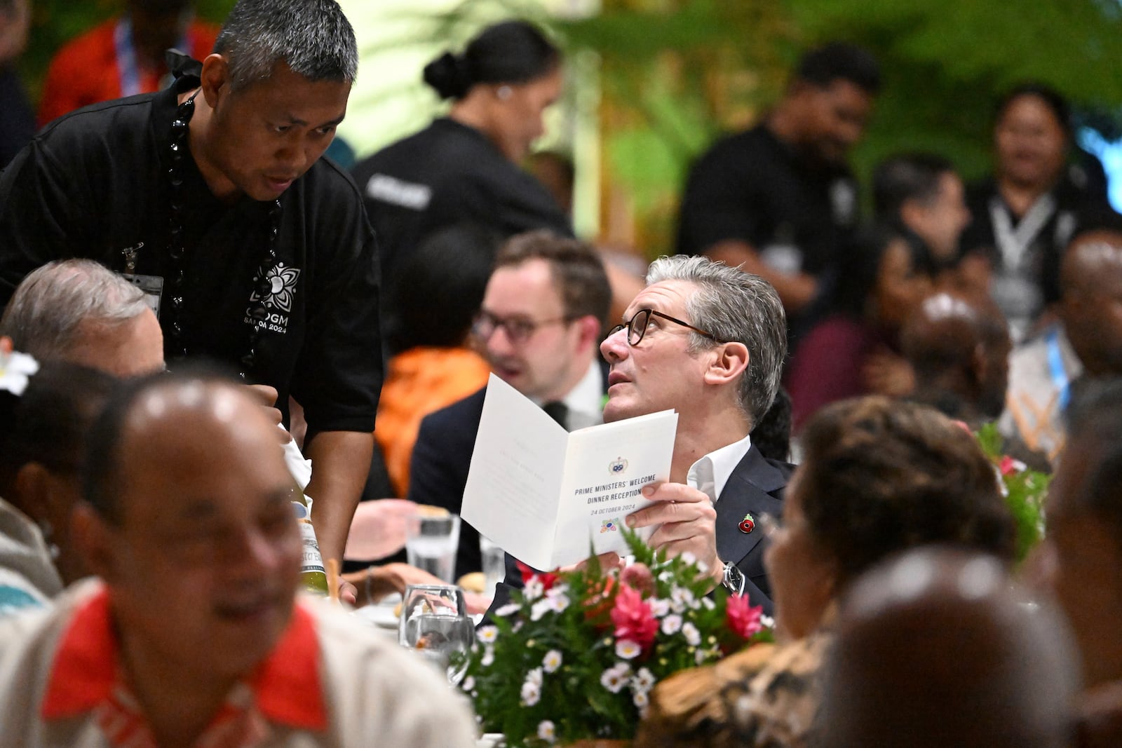 British Prime Minister Keir Starmer attends a State Banquet during the Commonwealth Heads of Government Meeting (CHOGM) in Apia, Samoa, on Thursday, Oct. 24, 2024. (William West/Pool Photo via AP)