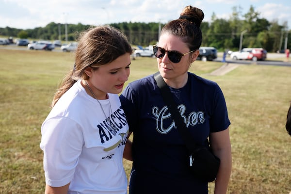 An Apalachee High School freshman, Payton Hucks, and her mother, Michelle Hucks, speak to an AJC reporter as they reflect on the dramatic moments during the shooting at the school on Wednesday morning. 
(Miguel Martinez / AJC)