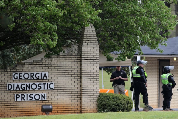 Corrections officers guard the entrance to the Georgia Diagnostic and Classification State Prison in advance of the execution of Joshua Bishop on Thursday evening, March 31, 2016. (Ben Gray / bgray@ajc.com)