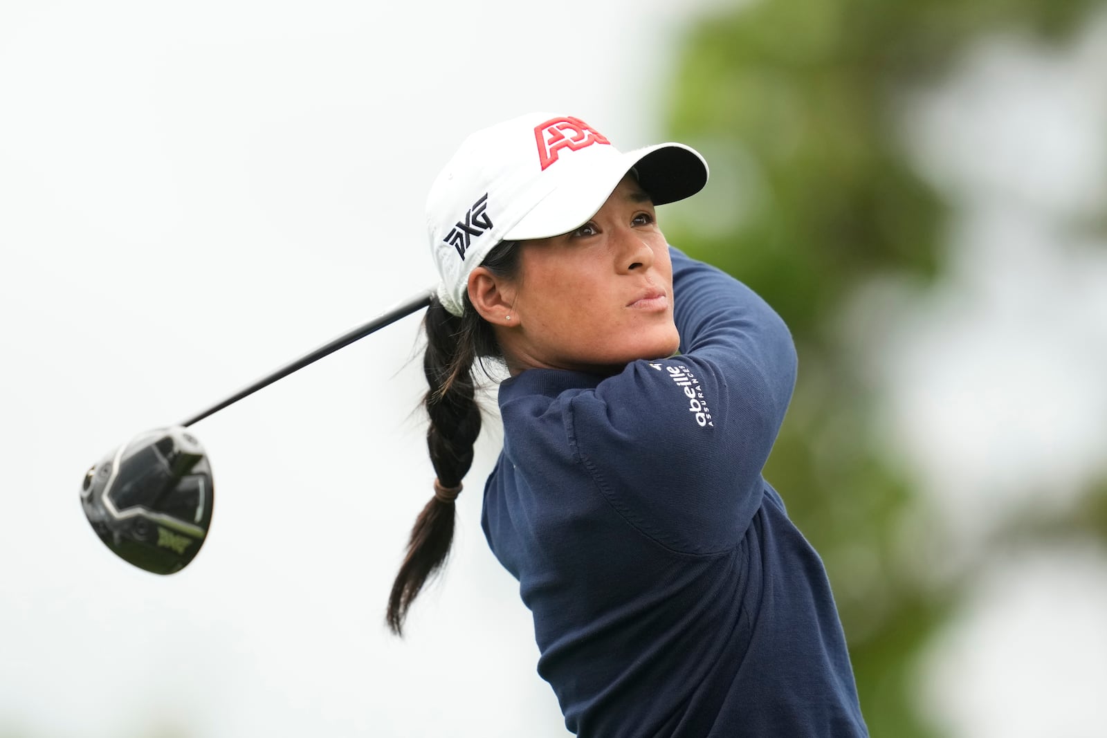 Celine Boutier of France watches her tee shot on the sixth hole during the third round of the LPGA Ladies Championship golf tournament at the Seowon Valley Country Club in Paju, South Korea, Saturday, Oct. 19, 2024. (AP Photo/Lee Jin-man)