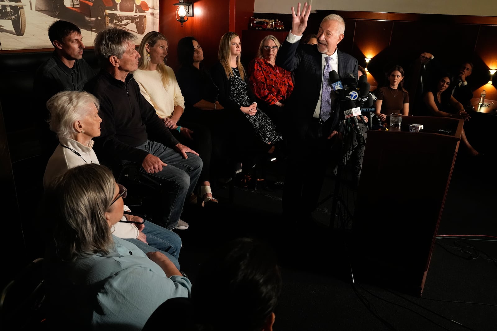 Mark Geragos defense attorney for Erik and Lyle Menendez surrounded by family members talks during a news conference on Thursday, Oct. 24, 2024, in Los Angeles. (AP Photo/Damian Dovarganes)