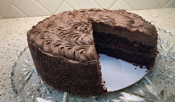 Southern Sweets’ old fashion chocolate cake is vegan, as it is made with Dutch processed cocoa and vegan Callebaut chocolate chunks and is frosted with a nondairy whipped topping. (Bill King for The Atlanta Journal-Constitution)