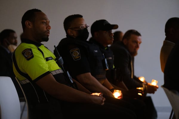 Police officers attend a vigil for LGBTQ+ victims of crime at Atlanta’s Central Library on Tuesday, June 28, 2022. The vigil was organized by the DA’s office and its LGBTQ+ advisory committee. (Arvin Temkar / arvin.temkar@ajc.com)