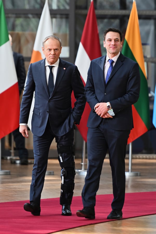 Poland's Prime Minister Donald Tusk, left, arrives for an EU Summit at the European Council building in Brussels, Thursday, March 6, 2025. (AP Photo/Harry Nakos)