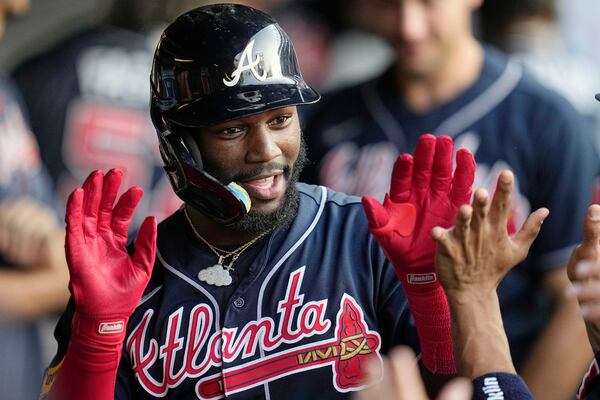 Atlanta Braves' Michael Harris II celebrates with teammates in the dugout following his home run in the fifth inning of a baseball game against the Cleveland Guardians, Monday, July 3, 2023, in Cleveland. (AP Photo/Sue Ogrocki)