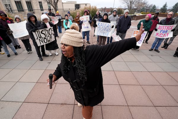 Laquanda Jacobs speaks at a rally outside the federal courthouse on what was to be the opening day of a trial for former police detective Roger Golubski, Monday, Dec. 2, 2024, in Topeka, Kan. (AP Photo/Charlie Riedel)