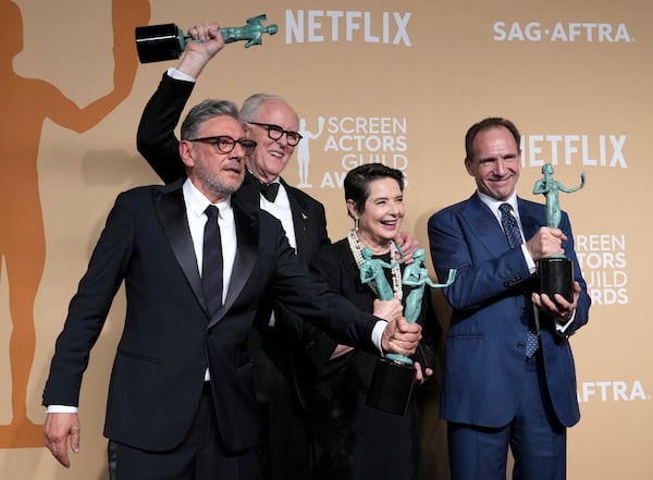 Sergio Castellitto, from left, John Lithgow, Isabella Rossellini, and Ralph Fiennes, winners of the award for outstanding performance by a cast in a motion picture for "Conclave," pose in the press room during the 31st annual Screen Actors Guild Awards on Sunday, Feb. 23, 2025, at the Shrine Auditorium in Los Angeles. (Photo by Jordan Strauss/Invision/AP)