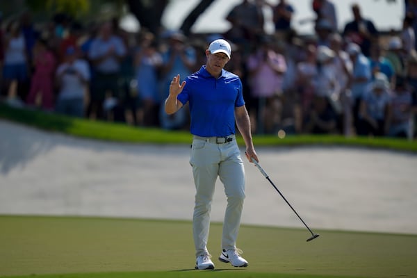 Rory McIlroy of Northern Ireland acknowledges the crowd after scoring a birdie on the 9th green in the final round of World Tour Golf Championship in Dubai, United Arab Emirates, Sunday, Nov. 17, 2024. (AP Photo/Altaf Qadri)