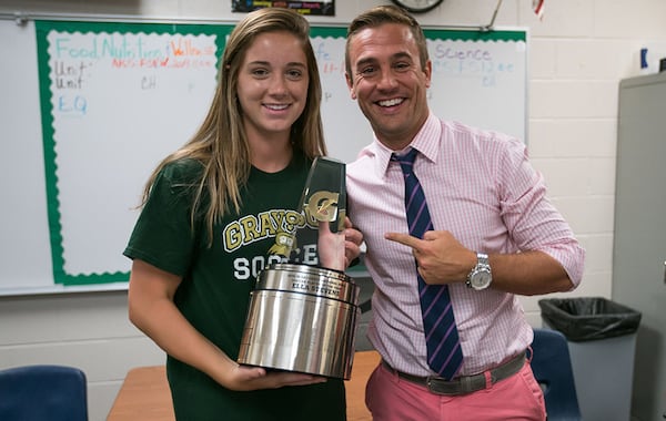 ESPN analyst and former MLS MVP Taylor Twellman presents Grayson's Ella Stevens with her trophy. (Gatorade)