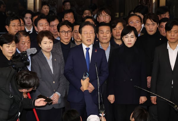 South Korea's main opposition Democratic Party leader Lee Jae-myung (center) speaks at the National Assembly in Seoul, South Korea, on Wednesday, Dec. 4, 2024. (Kim Ju-hyung/Yonhap via AP)