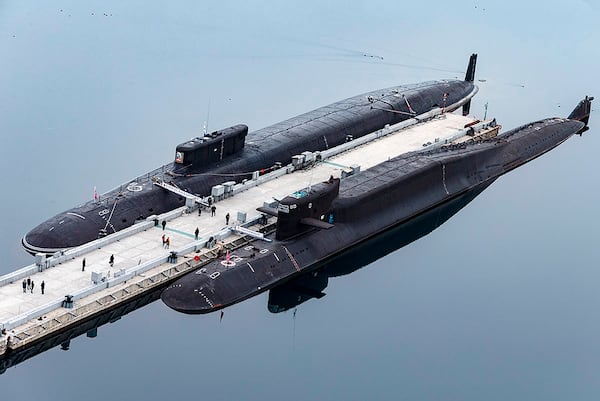 FILE - In this photo released by Russian Defense Ministry Press Service on April 13, 2021, Russian nuclear submarines Prince Vladimir, above, and Yekaterinburg are harbored at a Russian naval base in Gazhiyevo, Kola Peninsula, Russia. (Russian Defense Ministry Press Service via AP, File)