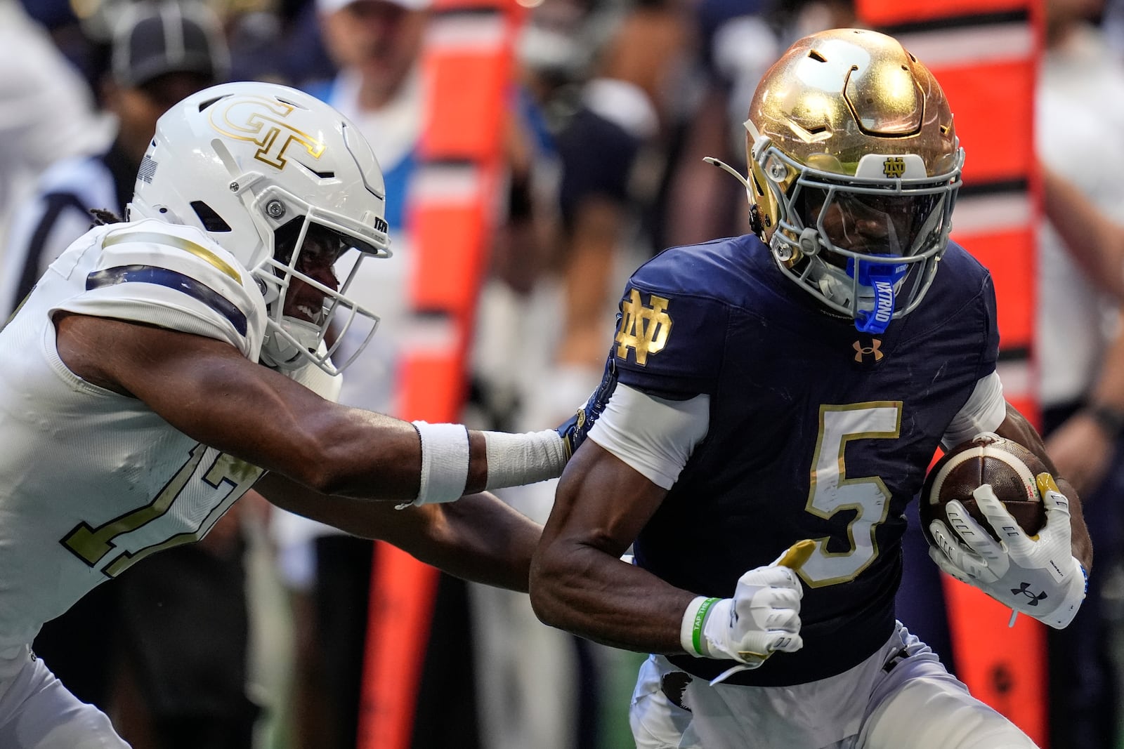 Notre Dame wide receiver Beaux Collins (5) runs against Georgia Tech linebacker Jackson Hamilton (17) during the first half of an NCAA college football game, Saturday, Oct. 19, 2024, in Atlanta. (AP Photo/Mike Stewart)