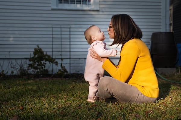 Callie Beale Harper, and daughter, at their home in Savannah, GA on December 5, 2024. Harper became an abortion rights activist after having to travel out of state for an abortion when she found out that one of the twins she was carrying had multiple severe, life-threatening medical conditions. Justin Taylor for the AJC