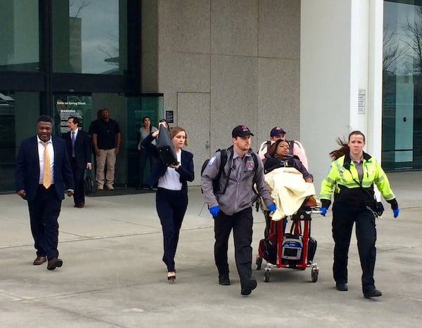 Katrina Taylor-Parks, the deputy chief of staff to former Atlanta Mayor Kasim Reed, is led out of the Richard B. Russell Federal Building by paramedics after she collapsed during her sentencing in the federal probe of corruption at Atlanta City Hall. 