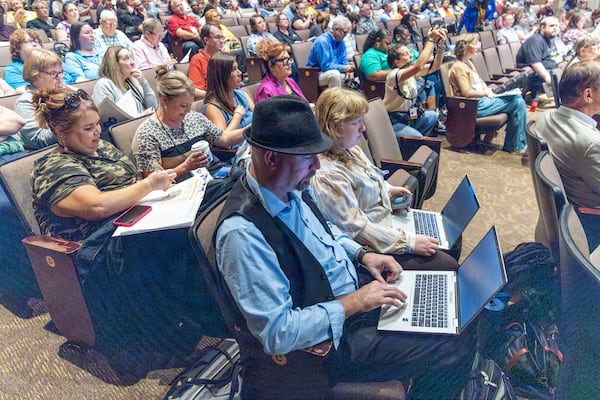 Georgia Election Officials take notes and listen to the speakers during a training session at the Public Safety Training Center in Forsyth on Tuesday, Aug 27, 2024.  (Steve Schaefer / AJC)