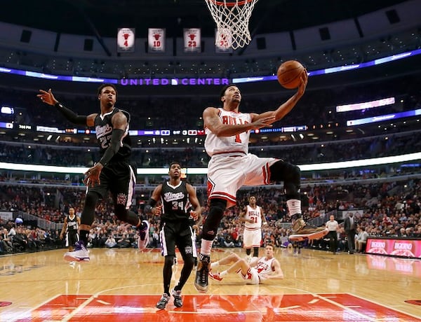 FILE - In this Feb. 10, 2015, file photo, Chicago Bulls guard Derrick Rose (1) drives past Sacramento Kings guard Ben McLemore (23) as Jason Thompson (34) watches during an NBA basketball game in Chicago. Rose will have surgery on his right knee for the second straight season. The team announced Tuesday night, Feb. 24, that Rose was feeling pain in his knee, and an exam and MRI confirmed a medial meniscus tear. (AP Photo/Charles Rex Arbogast, File) Derrick Rose, shelved again. (Charles Rex Arbogast/AP photo)