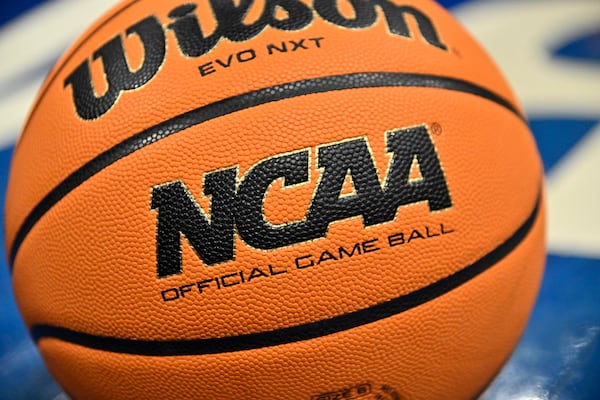 FILE - An official game ball sits on the court during the second half of an NCAA college basketball game between Southern California and UCLA in the semifinals of the Pac-12 tournament, March 8, 2024, in Las Vegas. (AP Photo/David Becker, File)