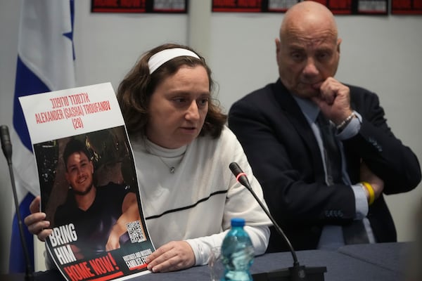 Elena Troufanov, left, and Louis Har, former Israeli hostages and relatives of some still being held by Hamas attend a press conference in Rome, Thursday, Nov. 14, 2024. (AP Photo/Alessandra Tarantino)