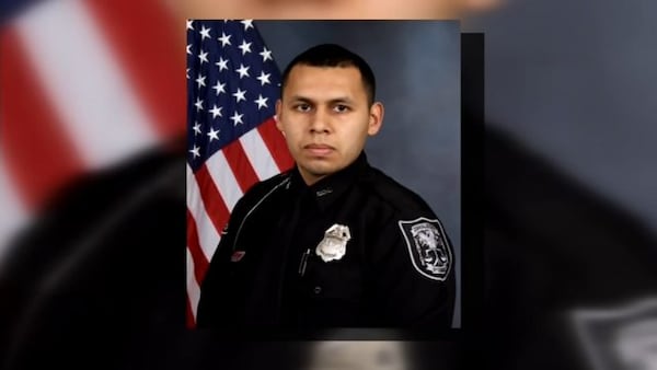 DeKalb police officer Edgar Isidro Flores, 24, died in the Dec. 13 shooting on Candler Road. 