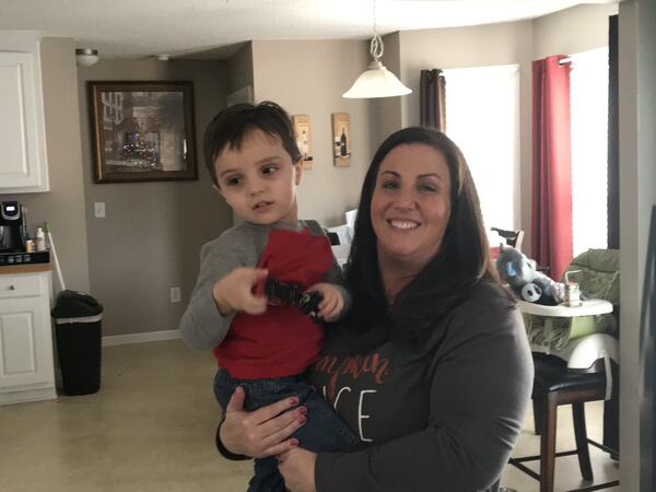 Reid and his mother, Jennifer Peteet, at home. Jennifer Peteet had to quit her full-time job to care for Reid, who was diagnosed with the mystery illness AFM. SHELIA POOLE / SPOOLE@AJC.COM