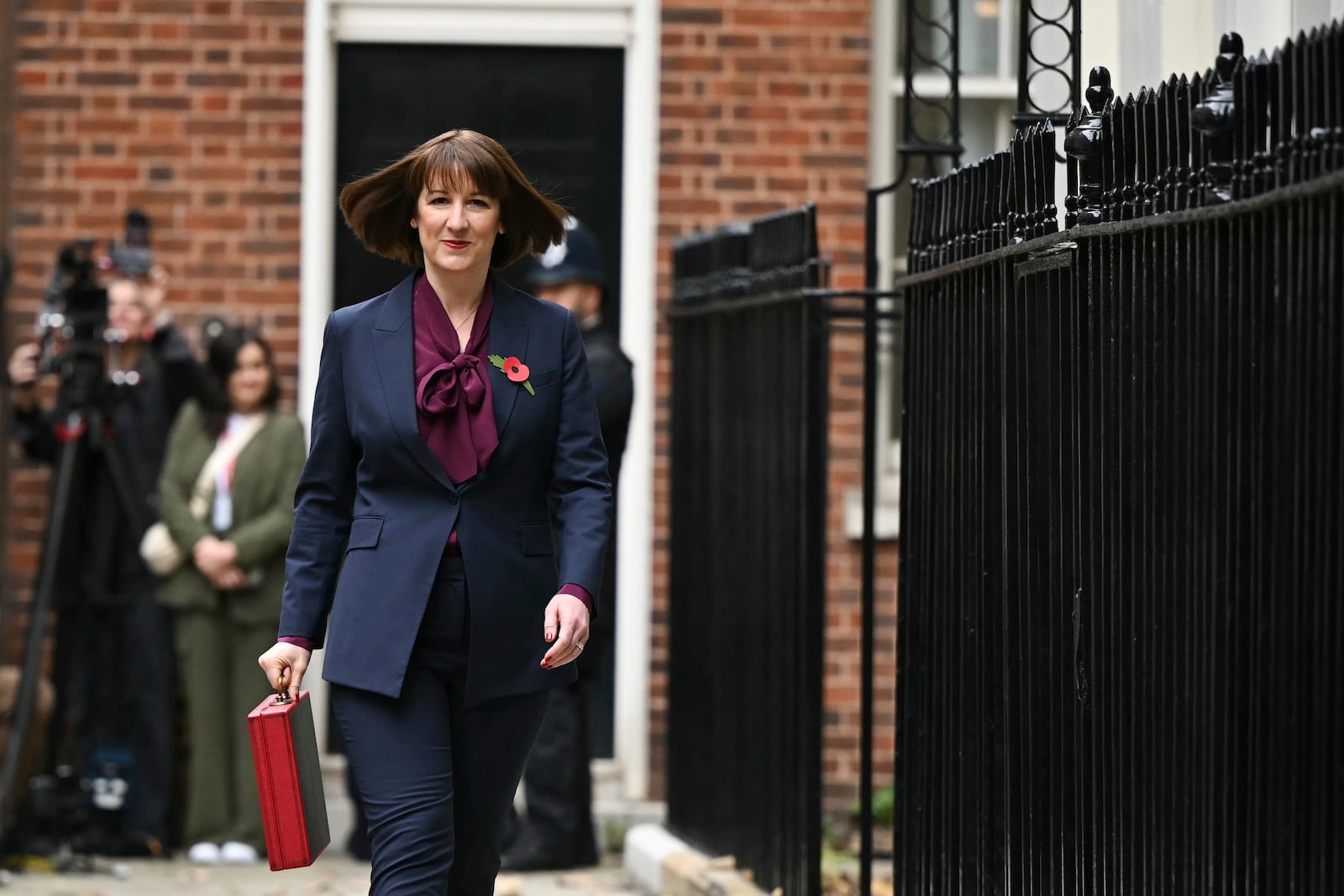 Britain's Chancellor of the Exchequer Rachel Reeves carries the traditional red ministerial box containing her budget speech, as she leaves No 11 Downing Street on her way to the House of Commons to deliver the budget, in London, Wednesday, Oct. 30, 2024. (Justin Tallis/Pool Photo via AP)