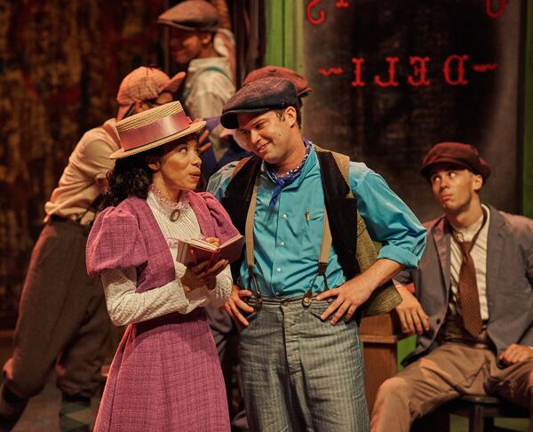 The Aurora/Atlanta Lyric musical “Newsies” features Adrianna Trachell and Greg Kamp (in foreground). CHRIS BARTELSKI