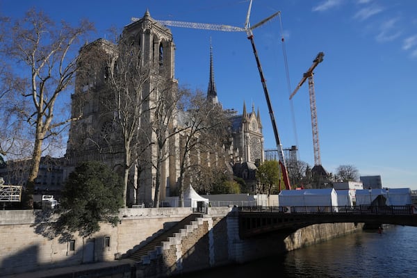 Cranes are seen by Notre-Dame cathedral, Thursday, Nov. 28, 2024 in Paris. (AP Photo/Michel Euler)