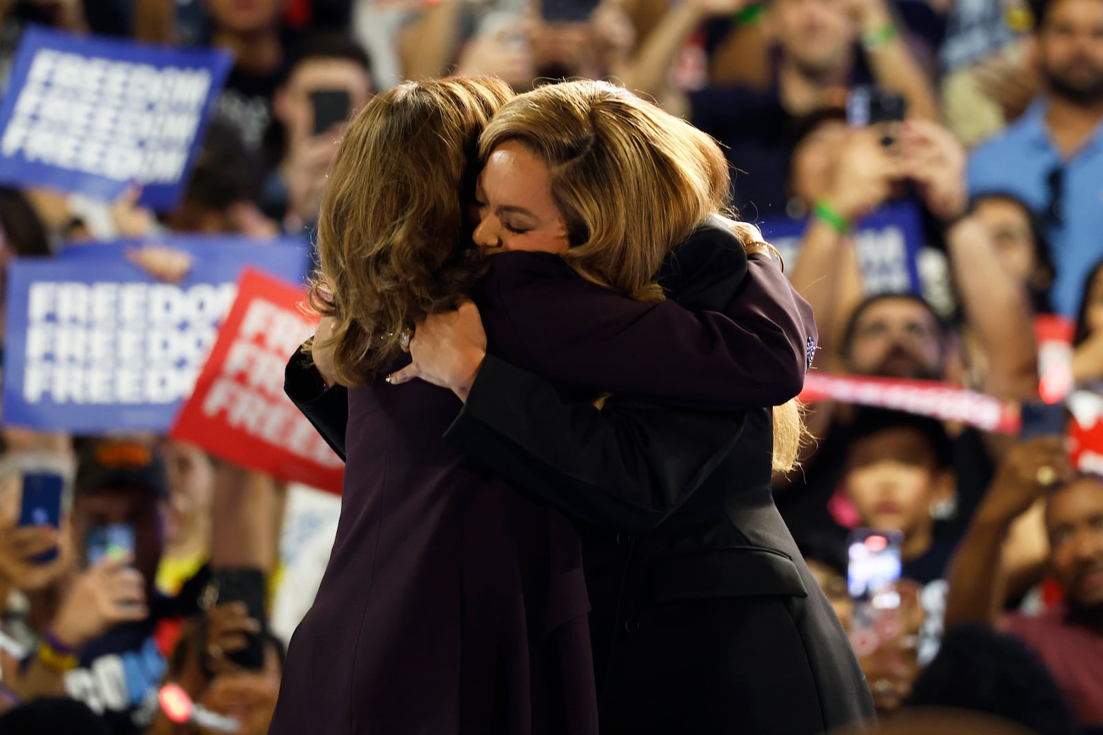 Musical artist Beyonce, right, and Democratic presidential nominee Vice President Kamala Harris, left, embrace on stage during a campaign rally Friday, Oct. 25, 2024, in Houston. (AP Photo/Annie Mulligan)