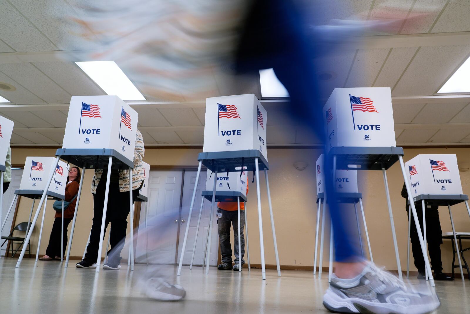 People vote, Tuesday, Nov. 5, 2024, in Oak Creek, Wis. (AP Photo/Morry Gash)