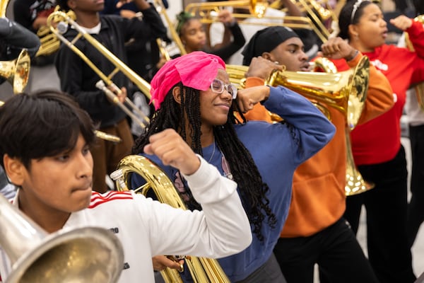 The Jonesboro High School marching band rehearses at the high school in Jonesboro on Wednesday, November 20, 2024. The band will play in the Macy's Thanksgiving Day Parade in New York and New Year's Day Parade in London. (Arvin Temkar / AJC)