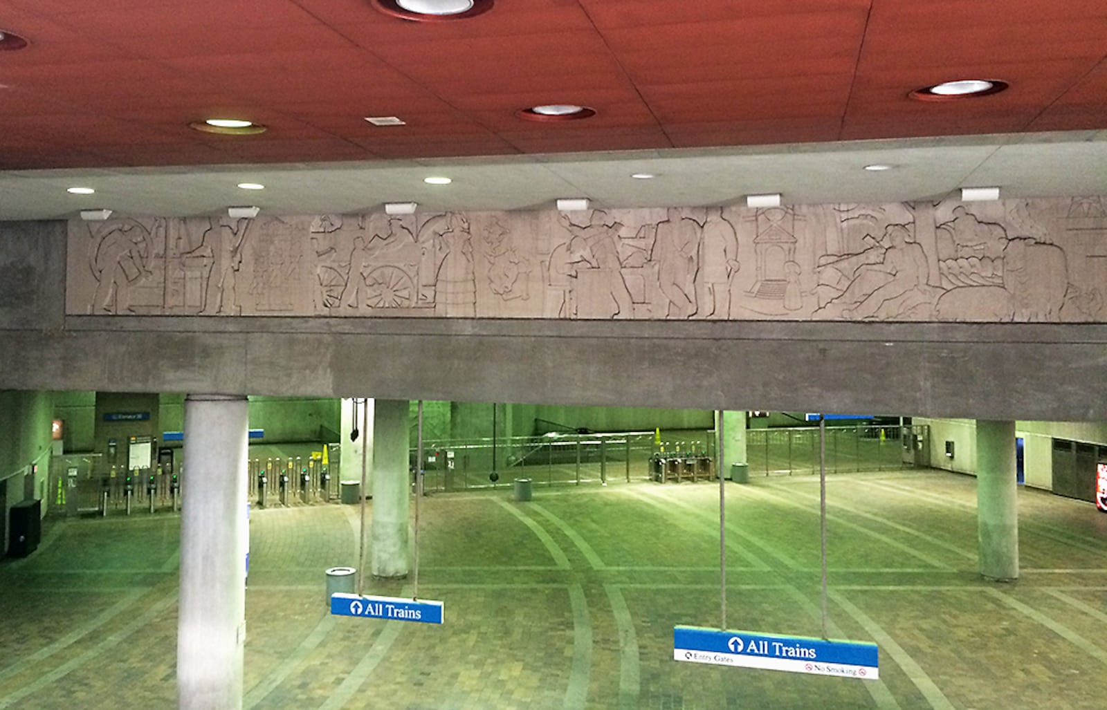 The Philips Arena MARTA station entrance preserves a bas-relief sculpture that was once part of the 143 Alabama Street building. (Pete Corson/AJC)