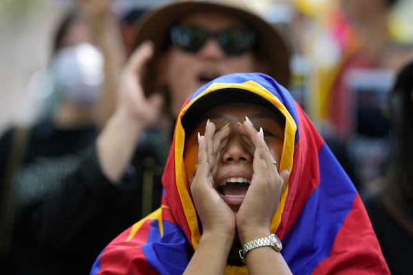 Exiled Tibetans shout slogans during a protest to commemorate the 1959 uprising in Tibet against the Chinese, in New Delhi, India, Monday, March, 10, 2025. (AP Photo/Manish Swarup)