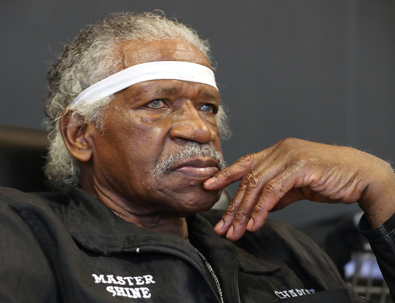 Charles Sanders, co-owner of Master Shine, waited for a customer in 2016 during a slow spell at Hartsfield-Jackson International. Curtis Compton /ccompton@ajc.com